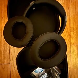 Ortim Black Over-Ear Headphones with Protective Zip Case and original charger.